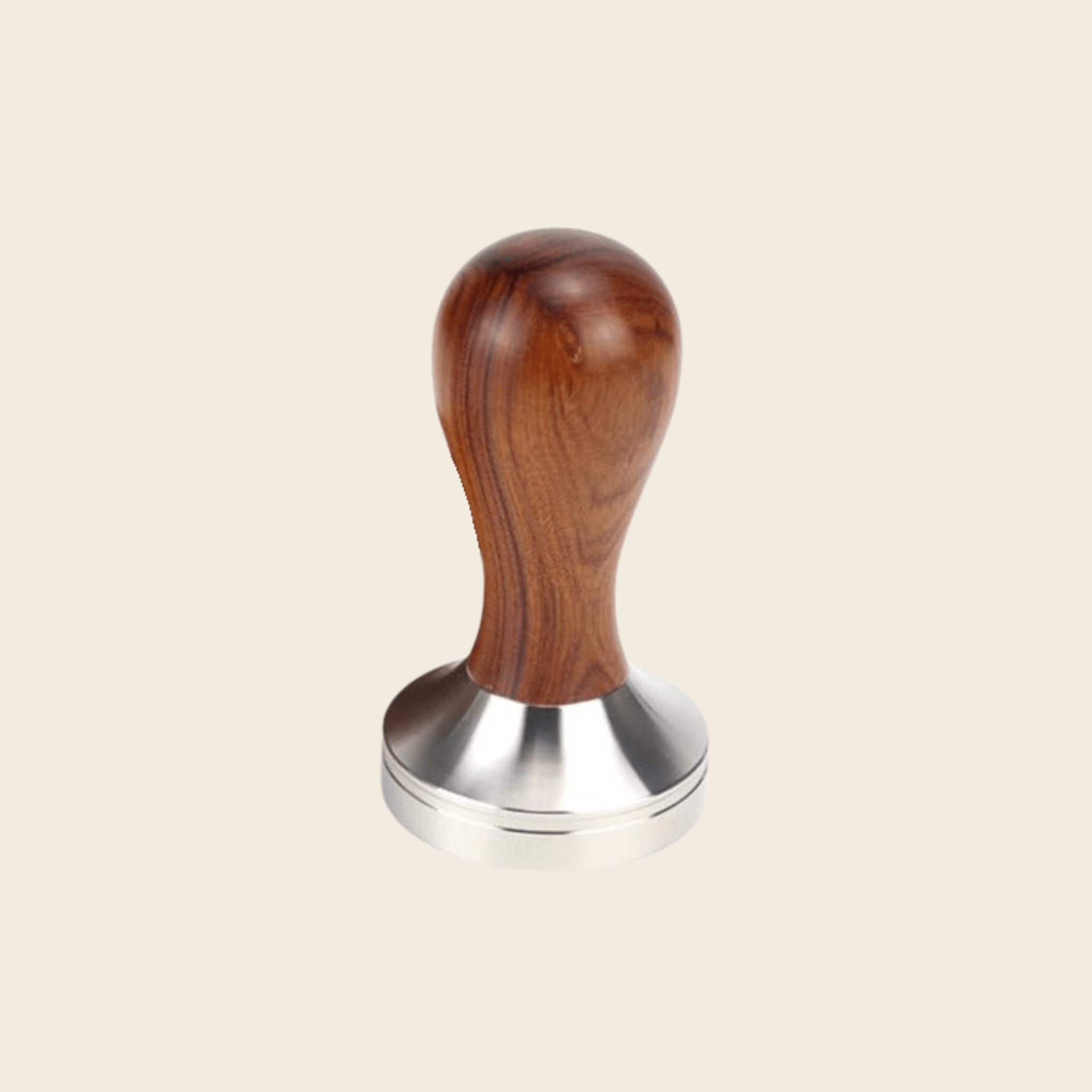 Wooden-handled metal tamp on a beige background