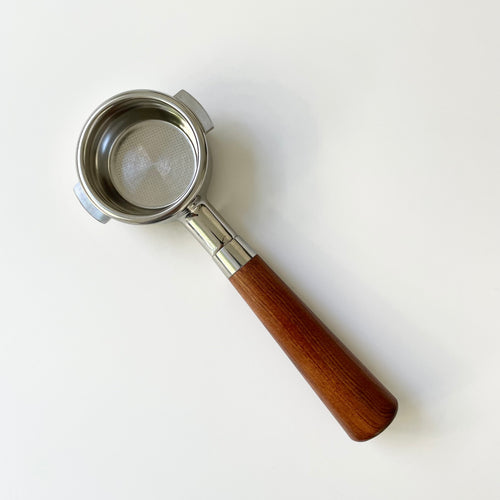 A bottomless portafilter with a 51mm size, featuring a two-ear design, almond-colored wooden handle, and stainless steel body.