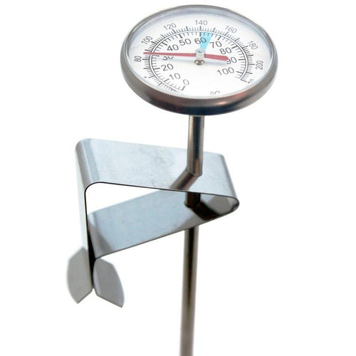 A stainless steel milk frothing thermometer with a clip and dial indicating temperature.